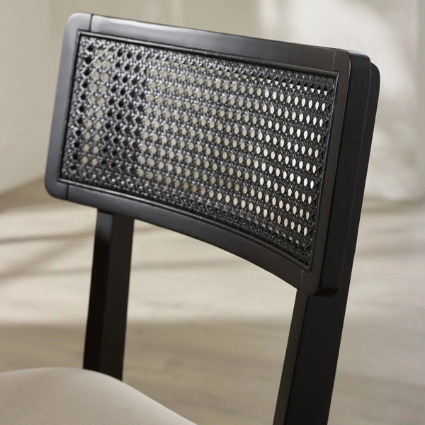 BLACK RATTAN CHAIR WITH CLOSE UP ON BACK REST 