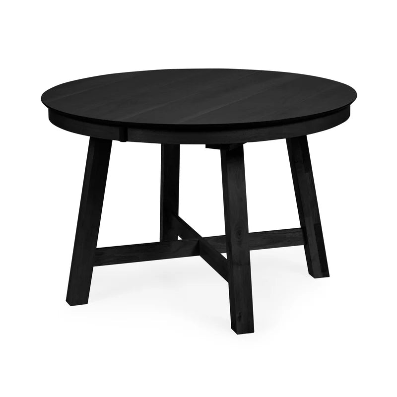 ROUND BLACK DINING TABLE ON A WHITE BACKGROUND 
