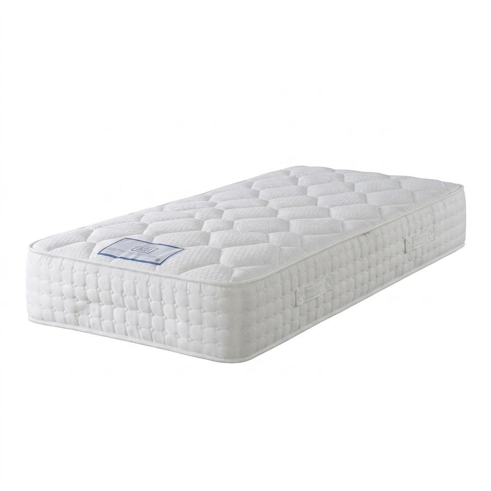 White mattress with a brand label on a white background