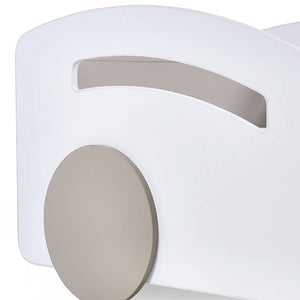 Close-up of a white and gray electronic device with a circular component.