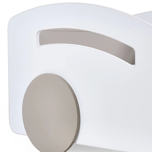 Close-up of a white and gray electronic device with a circular component.