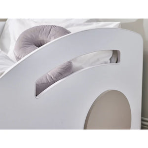 Gray cushion on a white pet bed with a white background