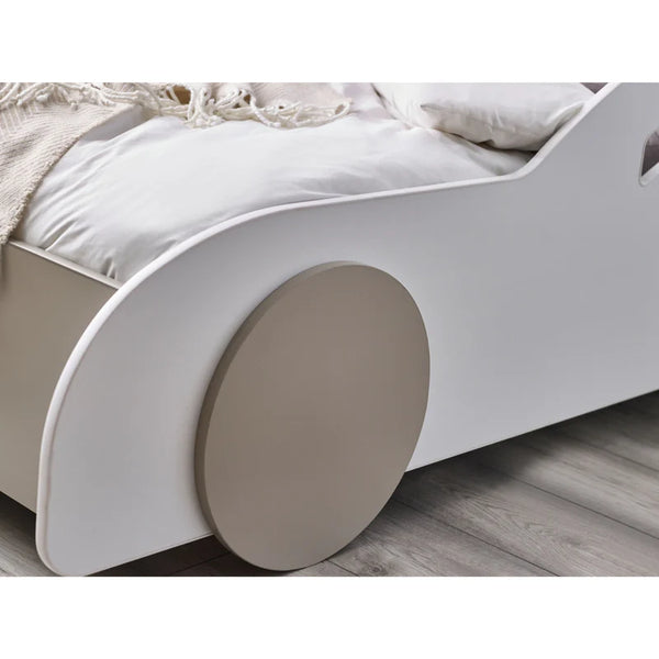 Children's bed with round end tables on a wooden floor