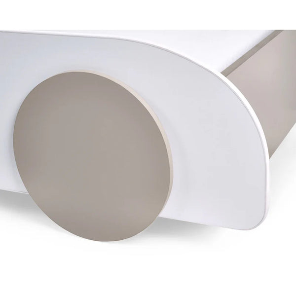 Close-up of a roll of white paper with a beige circle on a white background