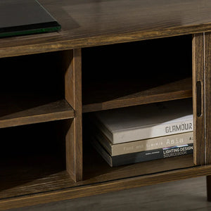 Wooden shelf with books and a laptop on top