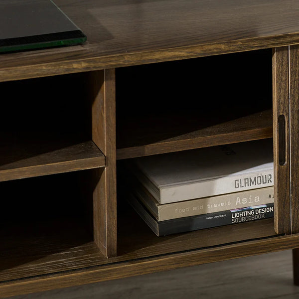 Wooden shelf with books and a laptop on top