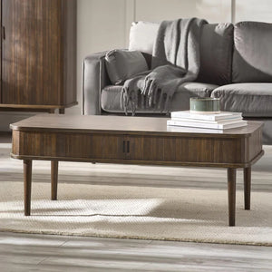 Wooden coffee table with books in a living room setting