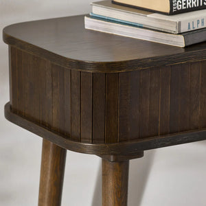 Wooden side table with a stack of books on a white background