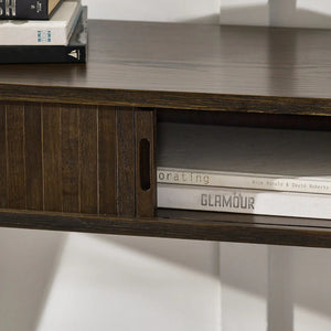 Wooden shelf with books and a magazine titled 'Glamour' on a white background
