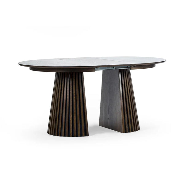 Modern dining table with unique base design on a white background