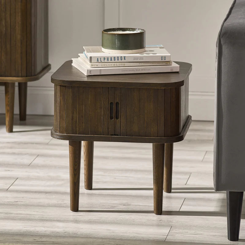 Wooden side table with a gray top on a white background