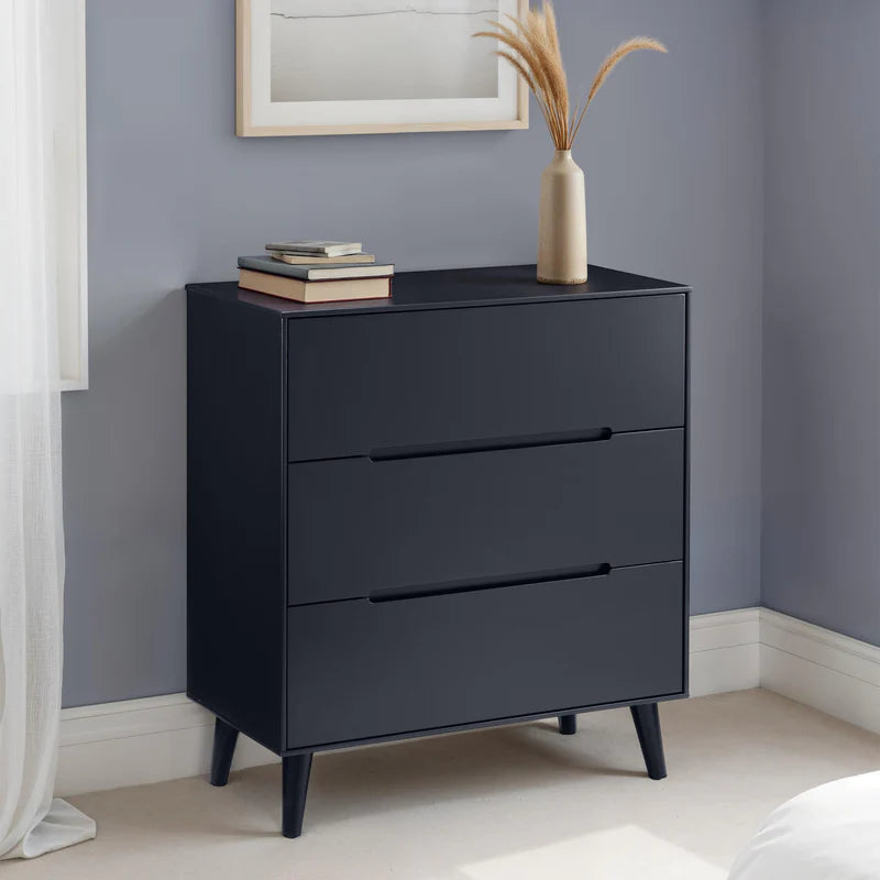 Black dresser with three drawers on a white background