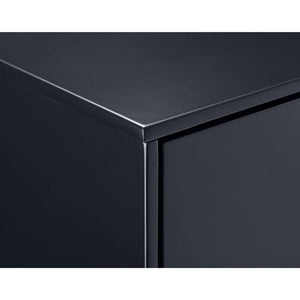 Close-up of a black metallic surface with a reflective finish