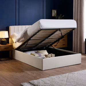 White bed with storage compartment in a bedroom setting