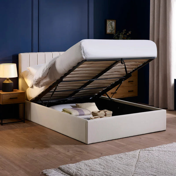 White bed with storage compartment in a bedroom setting
