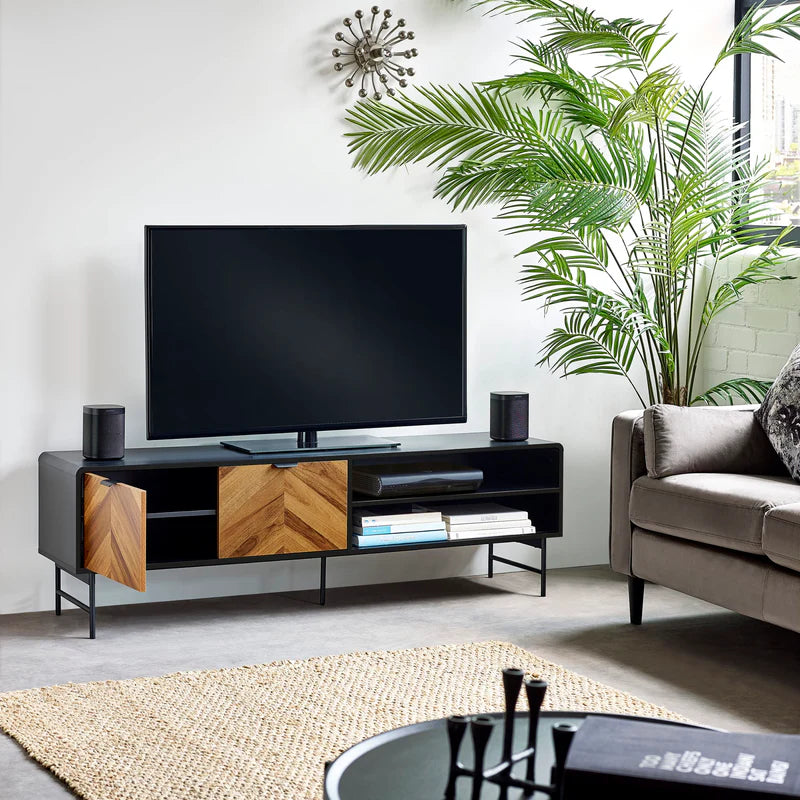 Modern TV stand with wooden and black design on a white background