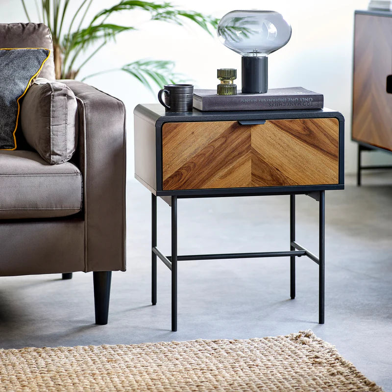 Side table with wooden drawer and gray top on a white background