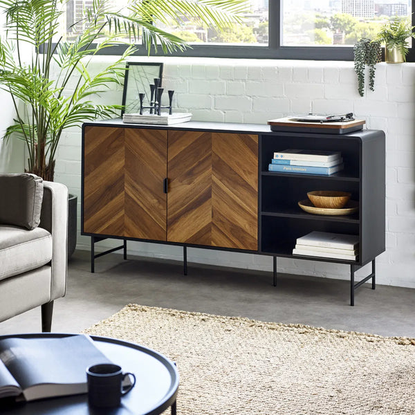 Modern living room with a wooden and black sideboard, sofa, and coffee table.