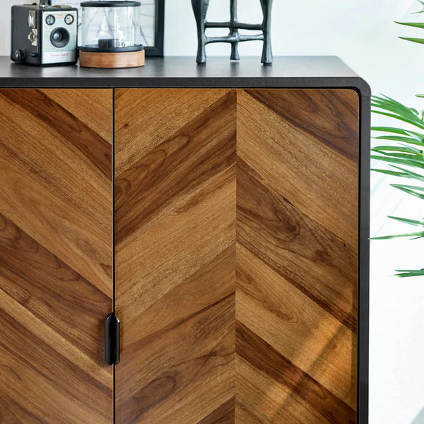 Wooden cabinet with chevron pattern in a room setting