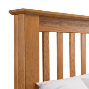 Wooden headboard with a white pillow on a white background
