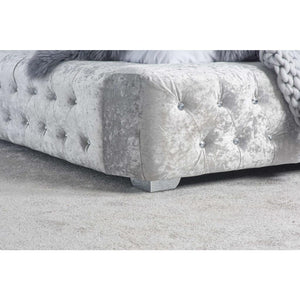 Silver textured bed frame with tufted detail with a silver foot