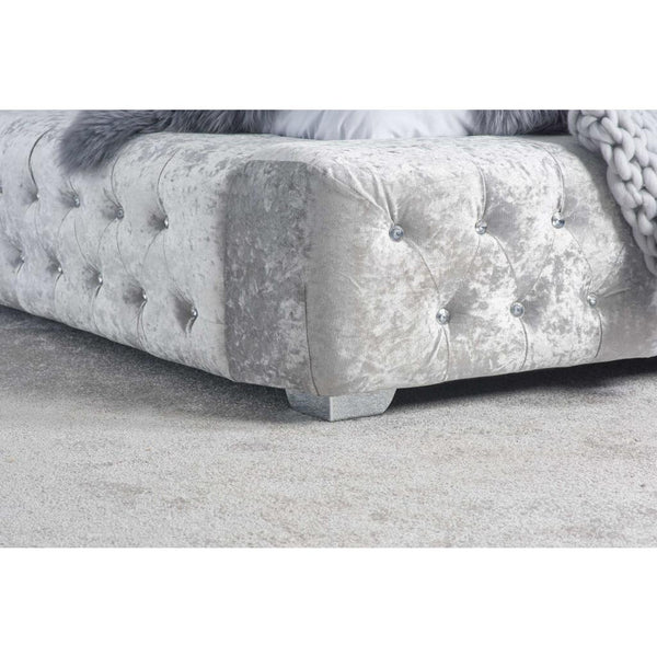 Silver textured bed frame with tufted detail with a silver foot