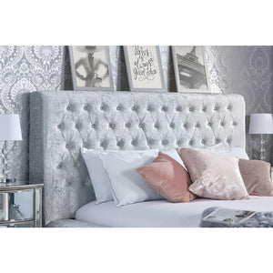 buttoned headboard in a room setting with cushions