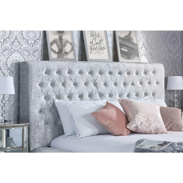 buttoned headboard in a room setting with cushions