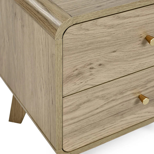 Wooden drawer with gold handles on a white background