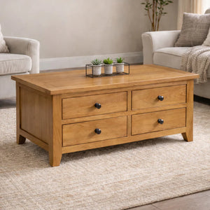 Wooden coffee table with four drawers in a living room setting