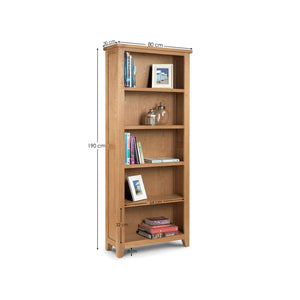Wooden bookshelf with books and decorative items on a white background
