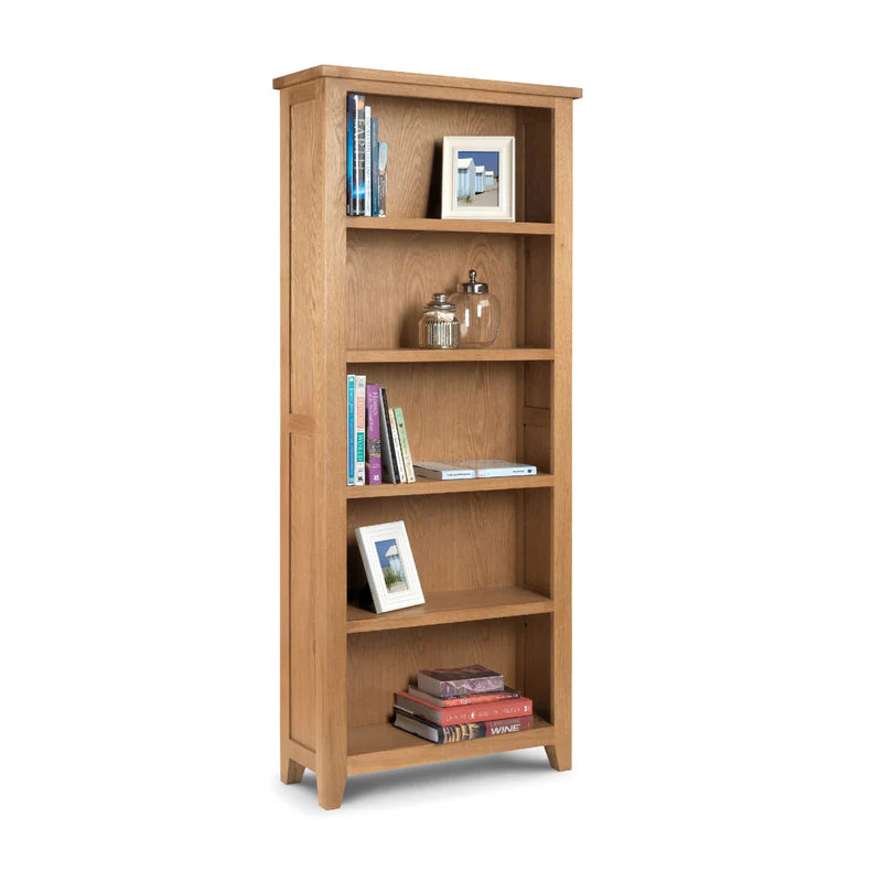 Wooden bookshelf with books and decorative items on a white background