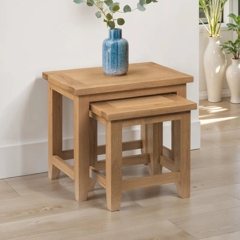 Set of two wooden nesting tables on a white background