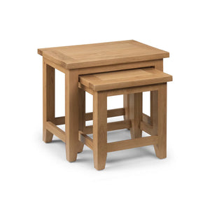 Set of two wooden nesting tables on a white background
