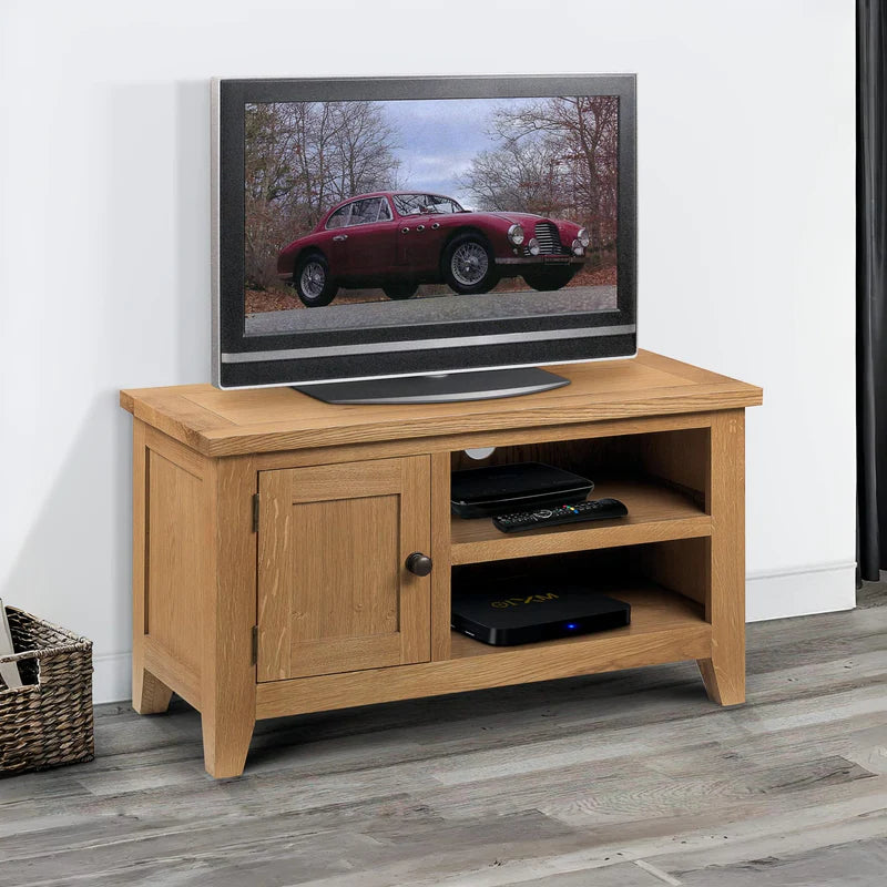 Wooden TV stand with a television displaying a car on a white background