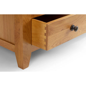Wooden drawer with a knob on a white background