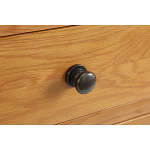 Wooden drawer with a metal knob on a white background