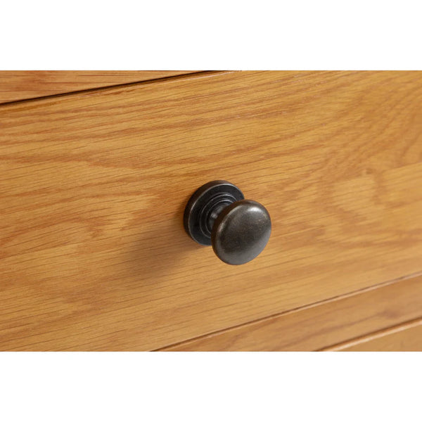 Wooden drawer with a metal knob on a white background
