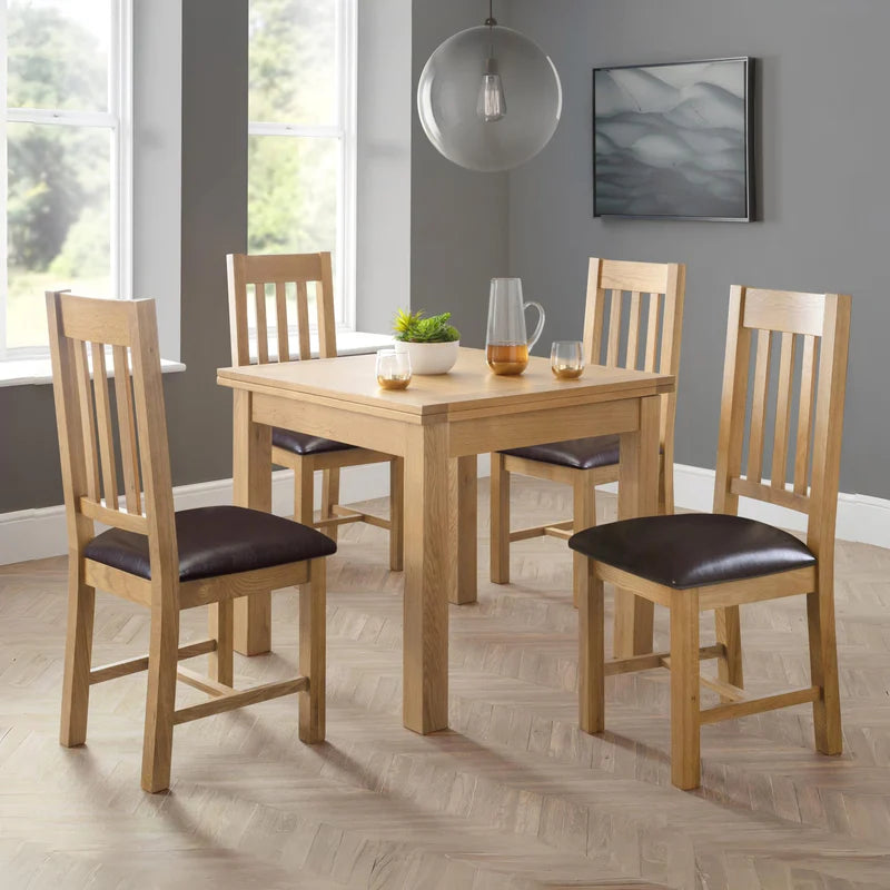 Two wooden chairs with brown seats on a white background