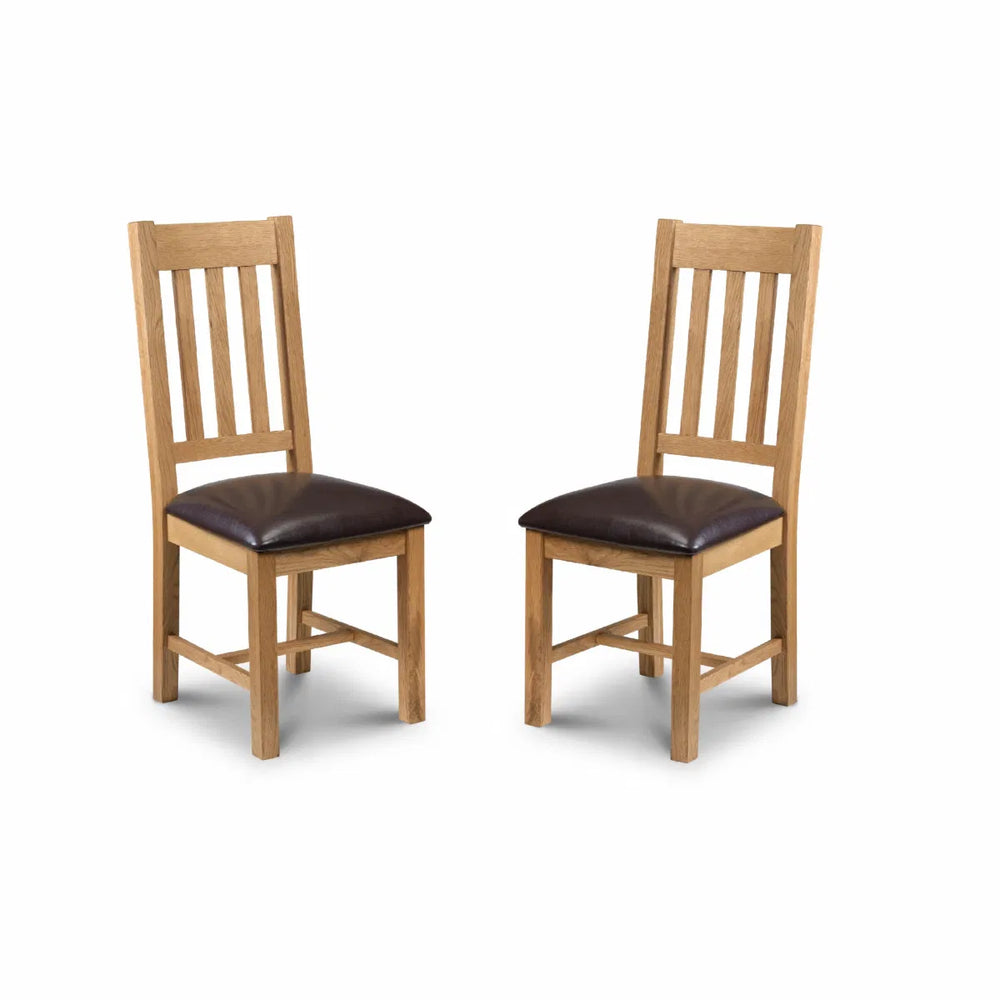 Two wooden chairs with brown seats on a white background