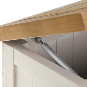 Close-up of a wooden shelf with a metal support inside a white cabinet.