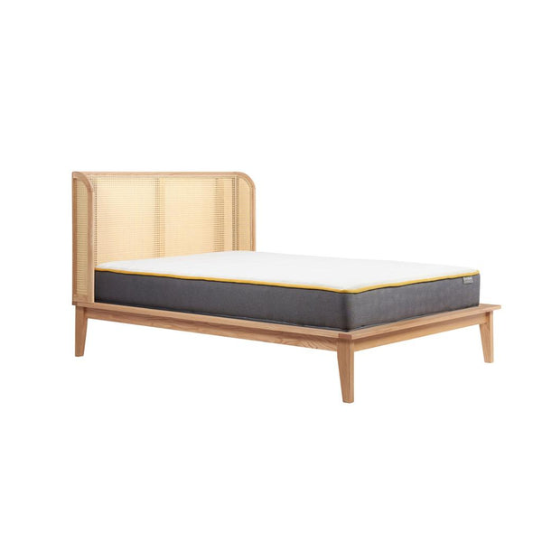 Wooden bed frame with mattress on a white background