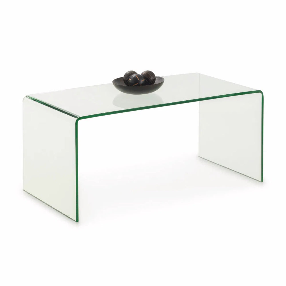 Clear glass coffee table with a decorative item on a white background