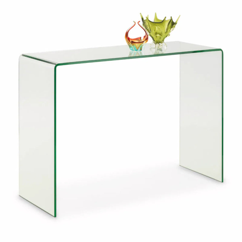 Clear glass side table with colorful glass bowls on a white background