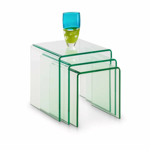 Set of clear glass nesting tables with a blue and green glass vase on top.
