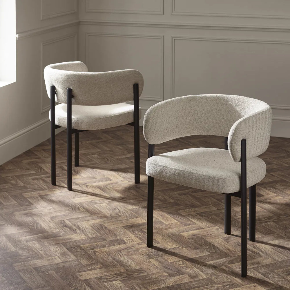 Beige chair with black legs on a white background
