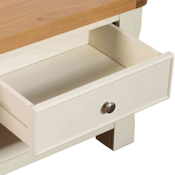 Wooden table with an open drawer on a white background
