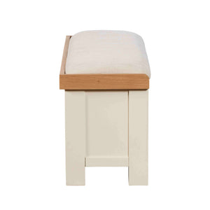 Stool with wooden frame and white cushion on a white background