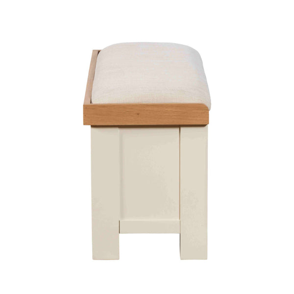 Stool with wooden frame and white cushion on a white background