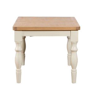 Small wooden table with white base on a white background